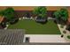Aerial view of a backyard with a lawn, patio, and thoughtfully designed landscaping at 8140 E June St, Mesa, AZ 85207