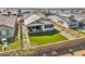 Aerial view of a fenced backyard with artificial grass and desert landscaping for low maintenance at 8140 E June St, Mesa, AZ 85207