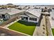 Expansive backyard features a lush green lawn with privacy fence, perfect for outdoor enjoyment at 8140 E June St, Mesa, AZ 85207