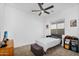 Bedroom featuring carpeted floors, a bed, ceiling fan and a window at 8140 E June St, Mesa, AZ 85207