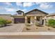 Charming single-Gathering home featuring a well-manicured front yard, a large garage, and welcoming curb appeal at 8140 E June St, Mesa, AZ 85207