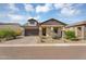 Beautiful home featuring a well-manicured front yard, a large garage, and welcoming curb appeal at 8140 E June St, Mesa, AZ 85207