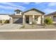 Charming single-Gathering home with a well-manicured front yard and a two-car garage at 8140 E June St, Mesa, AZ 85207