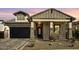Charming single-Gathering home with a brick-accented facade and a well-manicured desert landscape at 8140 E June St, Mesa, AZ 85207