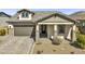 Charming one-story home with a brick-paved driveway and a two-car garage at 8140 E June St, Mesa, AZ 85207