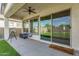 Covered patio featuring sleek chairs, a telescope, and a sliding glass door that overlooks the beautiful backyard at 8140 E June St, Mesa, AZ 85207