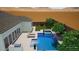 Stunning backyard oasis featuring a pool, lounging area, desert landscaping, and mountain views at 8140 E June St, Mesa, AZ 85207