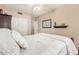 Bright bedroom with white bedsheets and closets with an access door to other rooms and carpet flooring at 826 W Royal Palms Dr, Gilbert, AZ 85233
