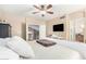 Light bedroom with soft carpet, opening to other rooms with white bedclothes at 826 W Royal Palms Dr, Gilbert, AZ 85233