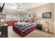 Inviting bedroom with blue accents, a cozy quilt, and a playful teddy bear, creating a fun and comfortable space at 826 W Royal Palms Dr, Gilbert, AZ 85233