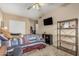 Bedroom with an oak ceiling fan, carpeted floor, and a closet at 826 W Royal Palms Dr, Gilbert, AZ 85233
