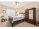 Comfortable bedroom with a dark wood bed, wardrobe with mirror, and plush carpet creating a relaxing atmosphere at 826 W Royal Palms Dr, Gilbert, AZ 85233