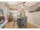 Cozy breakfast nook with vaulted ceilings and a ceiling fan adjacent to staircase at 826 W Royal Palms Dr, Gilbert, AZ 85233