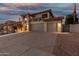 Attractive two-story home with a three-car garage, manicured landscaping, and a well-maintained driveway at 826 W Royal Palms Dr, Gilbert, AZ 85233