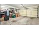 Spacious two-car garage with ample storage space and a clean concrete floor at 826 W Royal Palms Dr, Gilbert, AZ 85233