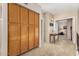 Carpeted hallway with built-in wooden cabinets and beige-painted walls at 826 W Royal Palms Dr, Gilbert, AZ 85233