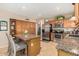 Bright kitchen featuring a granite-topped island, stainless steel appliances and ample wood cabinetry at 826 W Royal Palms Dr, Gilbert, AZ 85233
