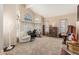 Spacious living room with vaulted ceilings, large windows, neutral decor, and a comfortable sitting area at 826 W Royal Palms Dr, Gilbert, AZ 85233
