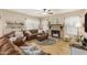 Spacious living room showcasing a fireplace, tile flooring, and plush leather seating at 826 W Royal Palms Dr, Gilbert, AZ 85233