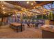 Inviting backyard featuring a dining table, outdoor kitchen, and a swimming pool at 8433 E Cholla St, Scottsdale, AZ 85260