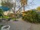 Backyard patio with a dining table, lounge area, and sparkling pool beyond at 8433 E Cholla St, Scottsdale, AZ 85260
