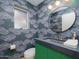 Charming powder room with unique wallpaper, a modern vanity, and a round mirror at 8433 E Cholla St, Scottsdale, AZ 85260