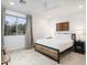 Comfortable bedroom with a queen bed, tile floors, and neutral-colored walls at 8433 E Cholla St, Scottsdale, AZ 85260