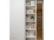 White bookshelf featuring books, desert-themed decorations, and a decorative plant at 8433 E Cholla St, Scottsdale, AZ 85260