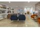 Charming living room featuring built-in shelving, stylish furniture, and a cozy fireplace at 8433 E Cholla St, Scottsdale, AZ 85260