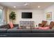 Modern living room featuring comfortable seating, a ceiling fan, and natural light at 8433 E Cholla St, Scottsdale, AZ 85260