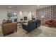 Cozy living room with stylish furniture, a fireplace, and natural light from sliding glass doors at 8433 E Cholla St, Scottsdale, AZ 85260