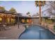 Inviting backyard pool area, outdoor seating, and lush desert landscaping create a relaxing oasis at 8433 E Cholla St, Scottsdale, AZ 85260