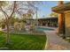 Stunning backyard with a sparkling pool, desert plants, and outdoor living spaces, perfect for entertaining at 8433 E Cholla St, Scottsdale, AZ 85260