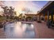 Inviting backyard pool featuring a bar, dining, and lounge area, perfect for outdoor entertaining at 8433 E Cholla St, Scottsdale, AZ 85260