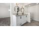 Bathroom featuring a dual sink vanity, modern fixtures, and great lighting at 8602 W Clarendon Ave, Phoenix, AZ 85037