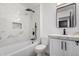 Modern bathroom featuring stylish tile, white vanity, and rainfall shower at 8602 W Clarendon Ave, Phoenix, AZ 85037