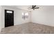 Bright living room featuring a ceiling fan, new floors and lots of natural light at 8602 W Clarendon Ave, Phoenix, AZ 85037