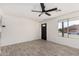 Bright living room featuring a ceiling fan, new floors and lots of natural light at 8602 W Clarendon Ave, Phoenix, AZ 85037