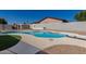 Backyard pool featuring artificial turf and desert landscaping at 8602 W Clarendon Ave, Phoenix, AZ 85037