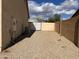Gravel backyard enclosed by a block wall, providing a blank canvas for landscaping and recreation at 8900 E Rainier Dr, Gold Canyon, AZ 85118
