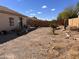 Spacious backyard offering potential for landscaping, relaxation, and outdoor activities at 8900 E Rainier Dr, Gold Canyon, AZ 85118