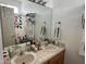 A bathroom with double sinks, countertop toiletries, and a shower/tub combo at 8900 E Rainier Dr, Gold Canyon, AZ 85118