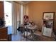 A dining room features a table, chairs, and sliding glass doors at 8900 E Rainier Dr, Gold Canyon, AZ 85118