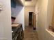 Hallway with tile floors, laundry area with washer and dryer, and access to a bathroom at 8900 E Rainier Dr, Gold Canyon, AZ 85118