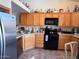 The kitchen is equipped with stainless steel appliances and wooden cabinets at 8900 E Rainier Dr, Gold Canyon, AZ 85118