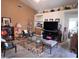 A cozy living room is decorated with vases, furniture, and a fireplace at 8900 E Rainier Dr, Gold Canyon, AZ 85118