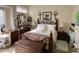 A bedroom features a bed, two night stands, and a dresser at 8900 E Rainier Dr, Gold Canyon, AZ 85118