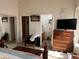 A main bedroom features a dresser, TV, walk-in closet, and ensuite bathroom at 8900 E Rainier Dr, Gold Canyon, AZ 85118
