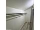 A very bright empty walk-in closet features wood floors and white walls at 9405 E Dallas St, Mesa, AZ 85207