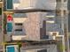 Aerial view of roof with solar panels and nearby community pools and landscaping at 9960 E Revolution Dr, Mesa, AZ 85212
